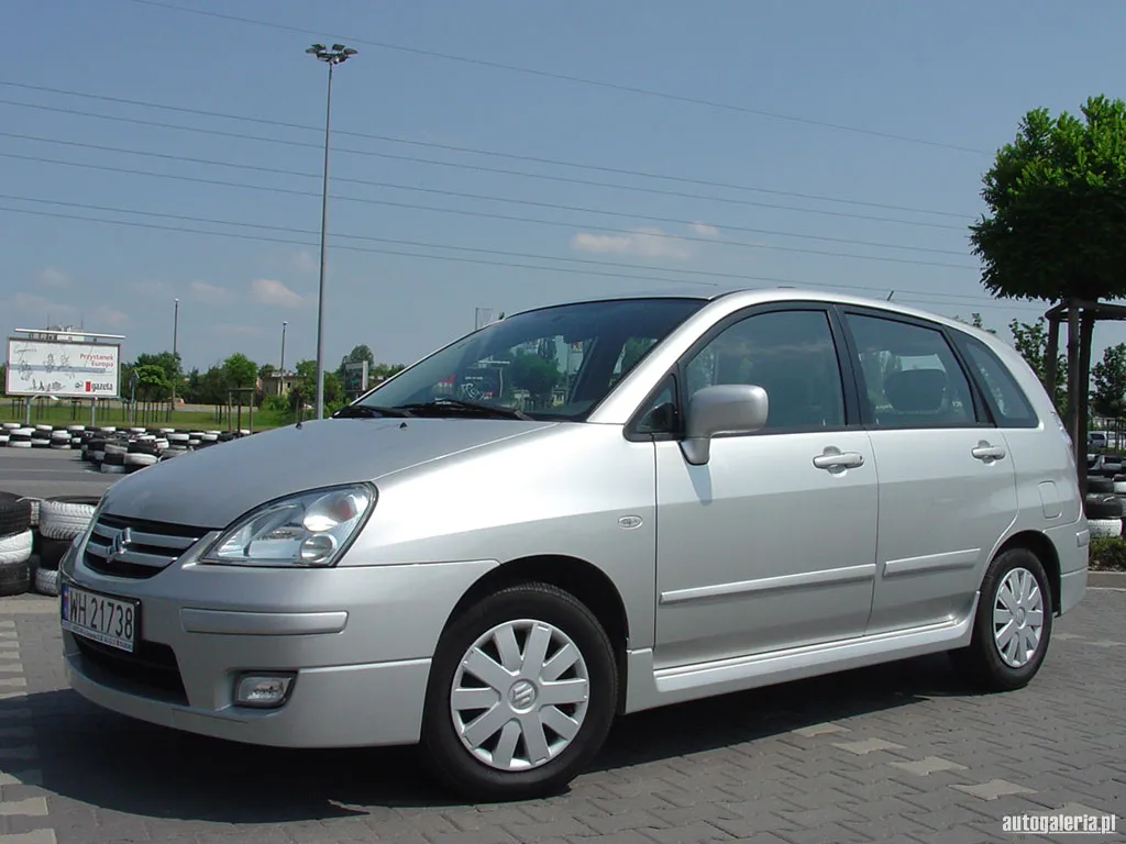 Эмблема suzuki liana